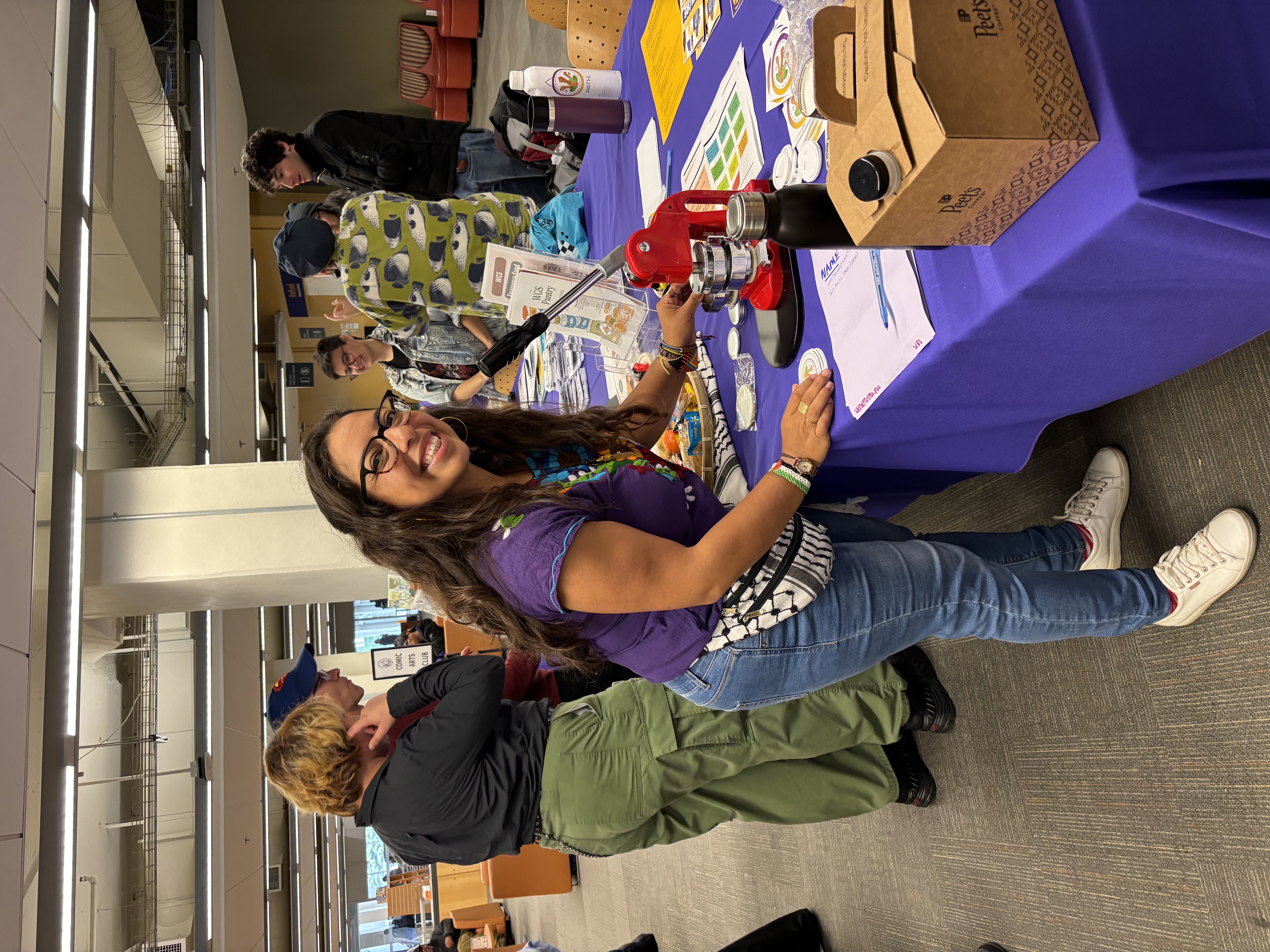 Dr. Leslie Quintanilla with her button machine